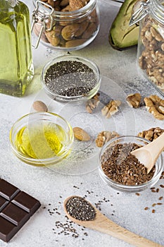 Healthy fats sources flax nuts oil avocado chia seeds bitter chocolate . Concept of healthy food
