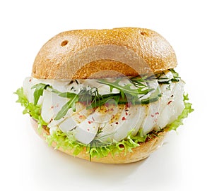 Healthy fish burger with rocket and mayonnaise
