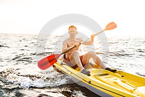 Healthy fit man on a kayak