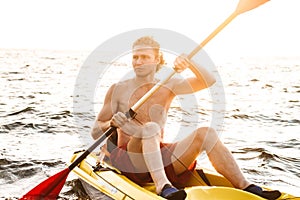 Healthy fit man on a kayak