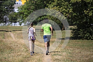 Healthy, fit and sportive couple running in park