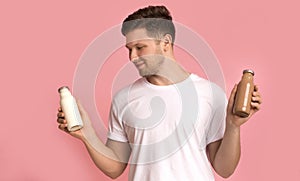 Healthy, fit young man choosing detox drink