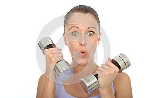 Healthy Fit Young Woman Training With Dumb Bell Weights Pulling Silly Facial Expression