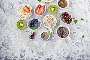 Healthy fitness food from fresh fruits, berries, greens, super food: kinoa, chia seeds, flax seed, strawberry, blueberry