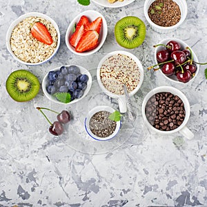 Healthy fitness food from fresh fruits, berries, greens, super food: kinoa, chia seeds, flax seed, strawberry, blueberry