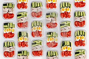 Healthy fitness food for the whole day. Multiple portions in containers photo