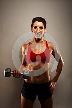 Healthy Fitness Woman Showing Her Muscles