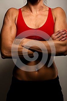 Healthy Fitness Woman Showing Her Muscles