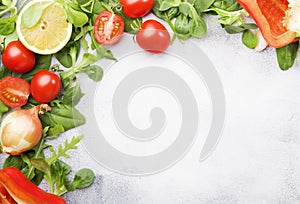 Healthy food background with various green herbs and vegetables. Ingredients for cooking salad. Vegetarian and vegan food concept