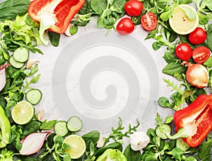 Healthy food background with various green herbs and vred vegetables. Ingredients for cooking salad. Top view, copy space