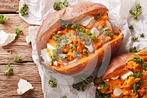 Healthy food: baked sweet potato stuffed with cheese and parsley