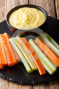 Healthy food: cheese cream sauce dip with fresh vegetables close
