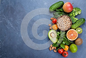 Healthy Food Clean Concept. Raw fruits, Vegetables, Nuts, Cereals on Table. Top view, copy space