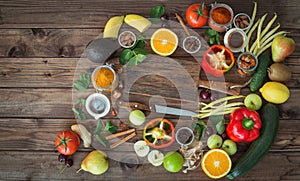 Healthy food, clean food selection: fruits, vegetables, seeds, spices on wooden background