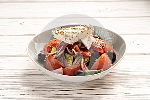 Healthy food concept. Greek salad with fresh vegetables and feta cheese.