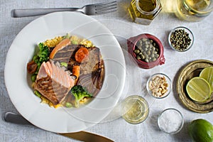 Grilled Salmon Steak with Vegetables on White Plate