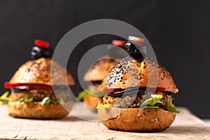 Healthy food concept Homemade mini hamburgers on wooden board with copy space