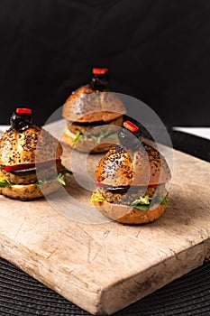 Healthy food concept Homemade mini hamburgers on wooden board with copy space