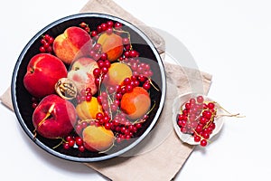 Healthy food concept Summer fruits Peach, apricot and red currant burry in pie pan