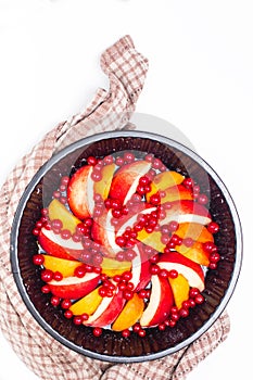 Healthy food concept Summer fruits Peach, apricot and red currant burry in pie pan