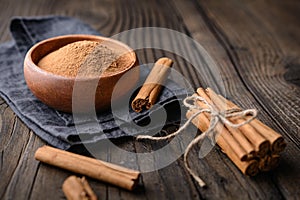 Healthy food condiment with medicinal properties, true Ceylon Cinnamon sticks and powder in a bowl