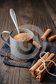 Healthy food condiment with medicinal properties, true Ceylon Cinnamon sticks and powder in a jar