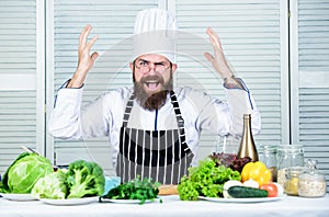 Healthy food cooking. Mature hipster with beard. Vegetarian salad with fresh vegetables. Dieting organic food. Cuisine