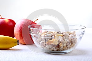 Healthy food with Corn Flakes cereal in a bowl, apple, banana and glass with milk. Morning breakfast.