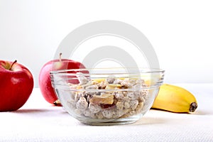 Healthy food with Corn Flakes cereal in a bowl, apple, banana and glass with milk. Morning breakfast.