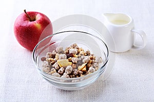 Healthy food with Corn Flakes cereal in a bowl, apple, banana and glass with milk. Morning breakfast.