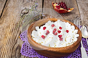 Healthy food. Cottage cheese with pomegranate seeds