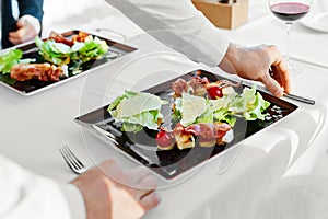 Healthy Food. Couple Eating Caesar Salad For Meal In Restaurant.