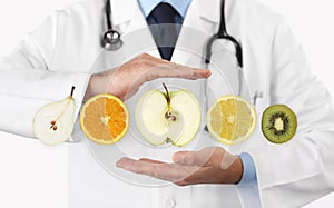 healthy food diet concept, Hands of nutritionist doctor with fruits photo