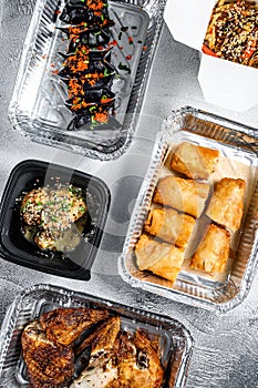 Healthy food and diet concept, restaurant dish delivery. Take away. Asian cuisine, dumplings, spring rolls, dim sum, Peking duck.