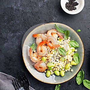 Healthy food is a dish for healthy diet. Shrimp, petite, edamame beans, black sesame, red pepper for lunch. Look all