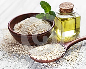 Sesame oil and seeds on a rustic table