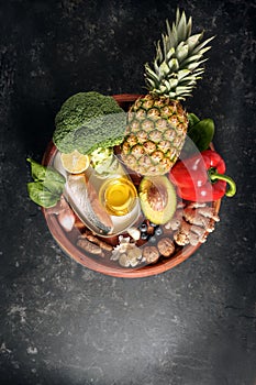 Healthy food with fiber, vitamin, omega-3 fatty acid and minerals for an anti-inflammatory and antioxidant diet on a round wooden