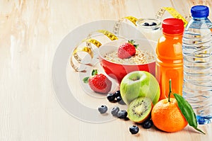 Healthy food and fitness concept. Fresh fruits, juice and cereal