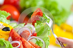 Healthy food fresh vegetable salad and fork photo