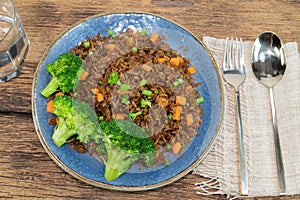 Healthy food fried rice with vegetalbe broccoli carrot bean in plate.