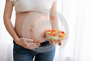 Healthy Food For Future Baby. Pregnant Woman Holding Bowl With Vegetable Salad