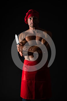 Healthy food for good body. brutal butcher. food additives. sexy man cook isolated on black. butcher with knife. man