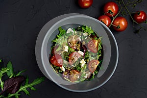 Healthy food. Greek salad with cucumber, tomato, sweet pepper, lettuce and feta cheese. Top view, copy space