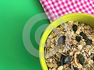 Healthy food green deep clay bowl of cereal pink white tablecloth
