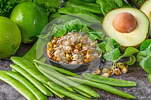 Healthy food, green vegetables, avocado, green peas, lettuce, lime, sprouted grains.Healthy food