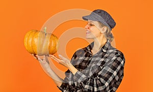 Healthy food growing. retro woman hold pumpkin. girl with gourd. farmer harvesting in countryside. fall seasonal concept