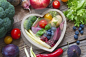 Healthy food in heart diet cooking concept with fresh fruits and vegetables