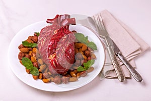 Healthy food and heart model. Nuts and berries. Medical abstract