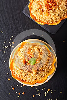 Healthy food homemade organic Quinoa Stuffed sweet dumpling squash on black slate stone with copy space