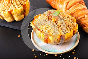 Healthy food homemade organic Quinoa Stuffed sweet dumpling squash on black slate stone with copy space